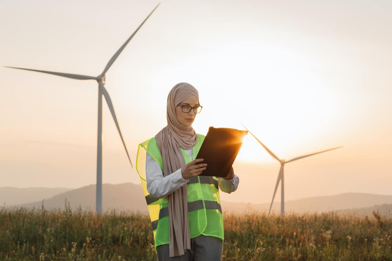 woman in agriculture using managed IT solutions in a field