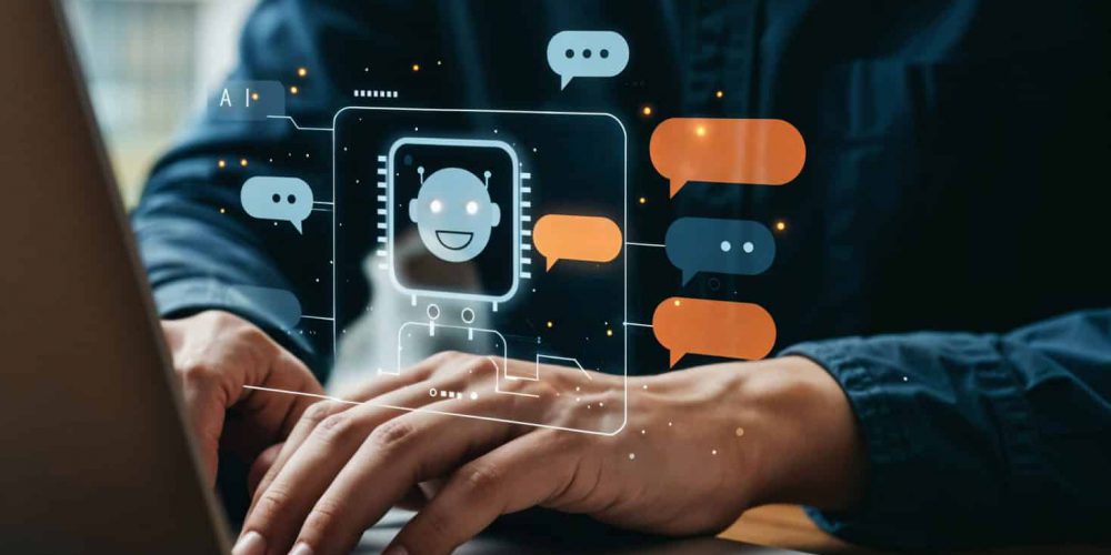 A Person Typing On A Laptop With A Digital Chatbot Interface Illustration Hovering Above The Keyboard, Representing AI And Conversational Technology In Business.