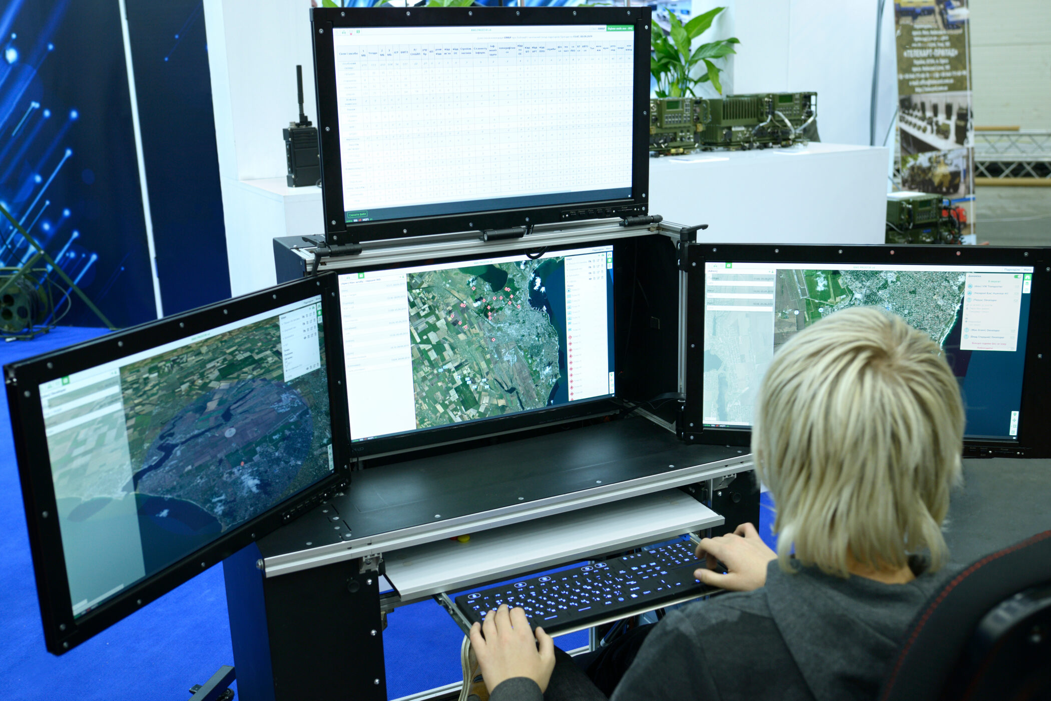 Person reviewing maps on multiple monitors, illustrating Zirous’s blog about AI agents for business.